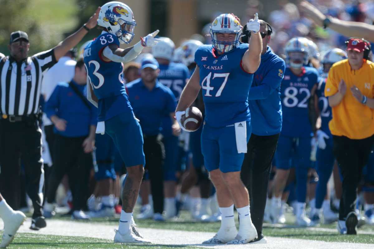 Kansas redshirt sophomore tight end Jared Casey (47) motions downfield getting a first down in the first quarter of Saturday's game inside David Booth Kansas Memorial Stadium.