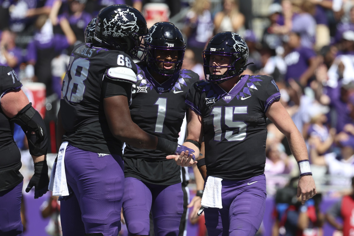 Oct 1, 2022; Fort Worth, Texas, USA; TCU Horned Frogs quarterback Max Duggan (15) celebrates with TCU Horned Frogs wide receiver Quentin Johnston (1) and TCU Horned Frogs offensive tackle Michael Nichols (68) after scoring a touchdown during the second half against the Oklahoma Sooners at Amon G. Carter Stadium. Mandatory Credit: Kevin Jairaj-USA TODAY Sports