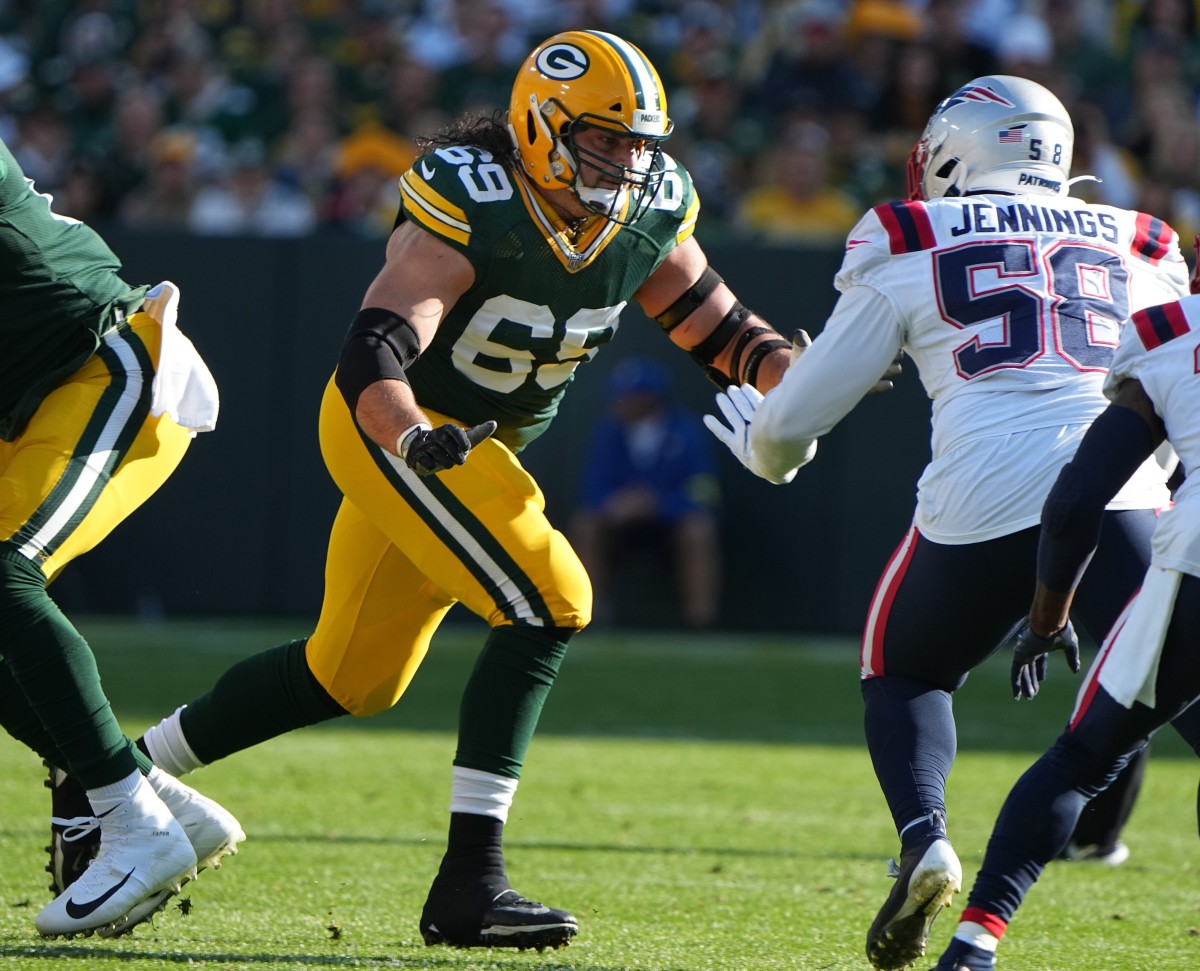 Green Bay Packers' David Bakhtiari (69) looks to Blok New England Patriots linebacker Anfernee Jennings (58) during the first quarter of their game Sunday, October 2, 2022 at Lambeau Field in Green Bay, Wis.