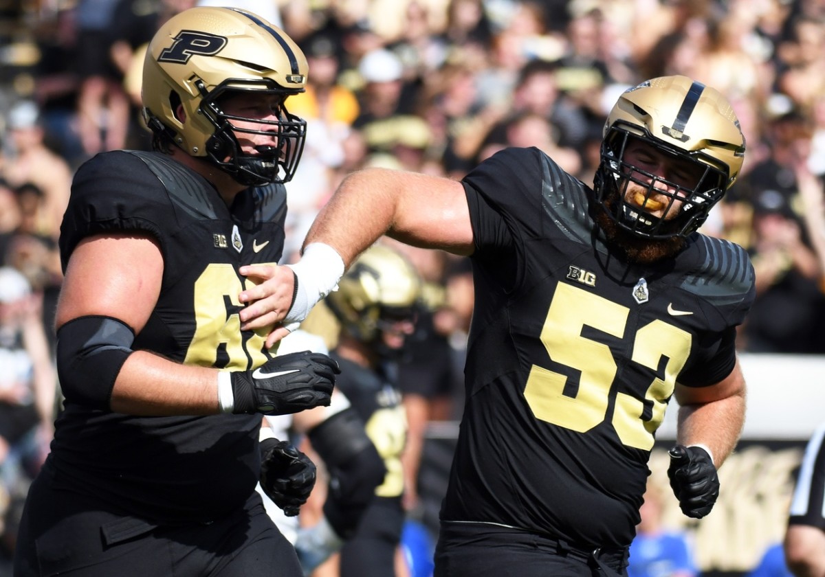 Sep 10, 2022; West Lafayette, Indiana, USA; Purdue Boilermakers offensive lineman Gus Hartwig (53) celebrates with Purdue Boilermakers offensive lineman Cam Craig (68) after a touchdown during the first quarter against Indiana State Sycamores at Ross-Ade Stadium.