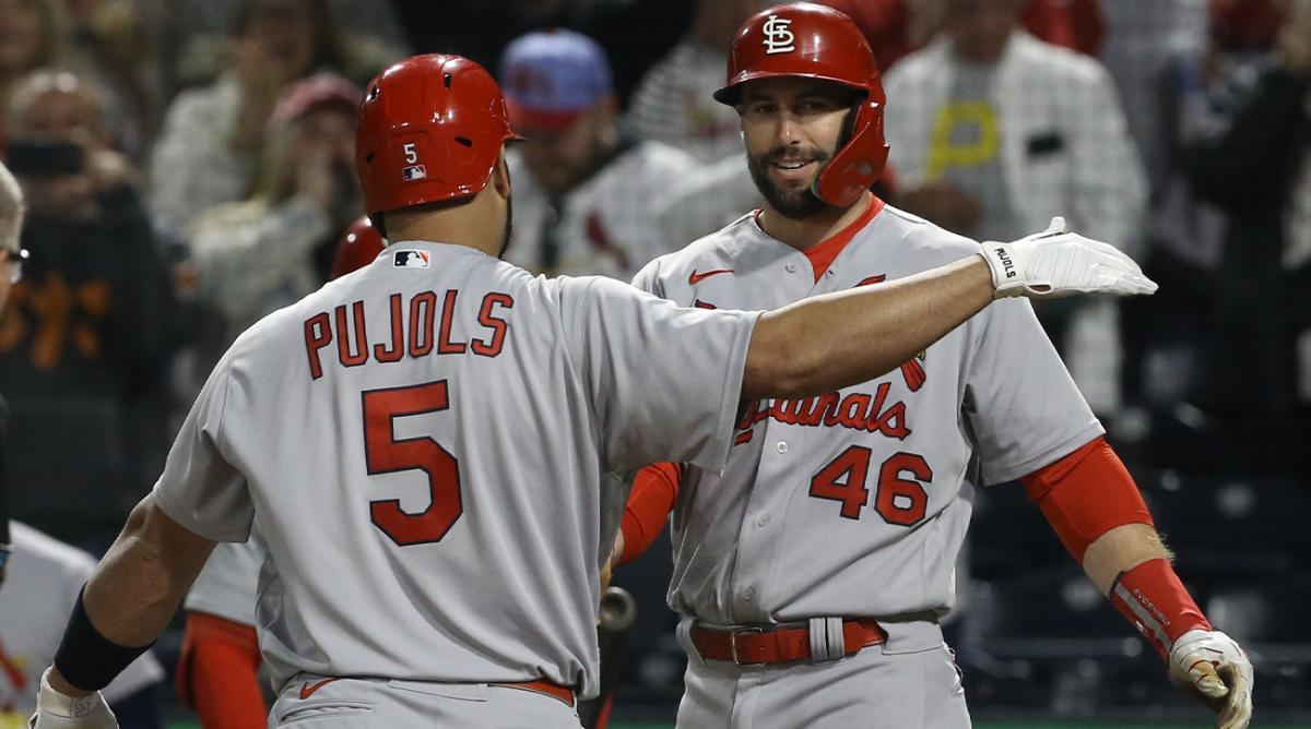 Oct 3, 2022; Pittsburgh, Pennsylvania, USA; St. Louis Cardinals first baseman Paul Goldschmidt (46) celebrates with designated hitter Albert Pujols (5) after Pujols crosses home plate on a two run home run against the Pittsburgh Pirates during the sixth inning at PNC Park. The home run was the 703rd of Pujols career and the two runs batted in moved him into second place on the all-time MLB RBI list with 2216 runs batted in.