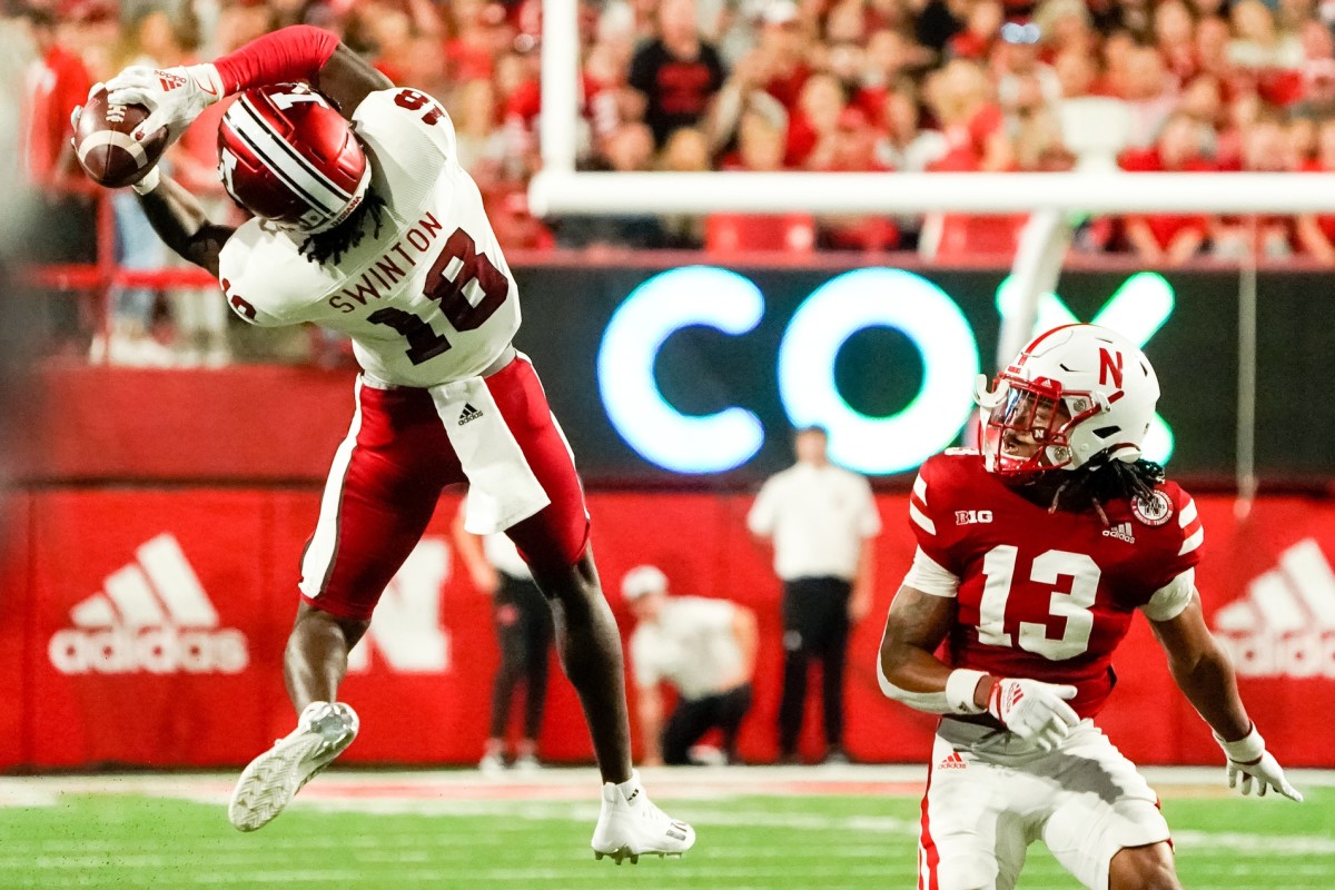 Indiana Hoosiers wide receiver Javon Swinton (18) catches a pass against Nebraska Cornhuskers defensive back Malcolm Hartzog (13) during the second quarter at Memorial Stadium.