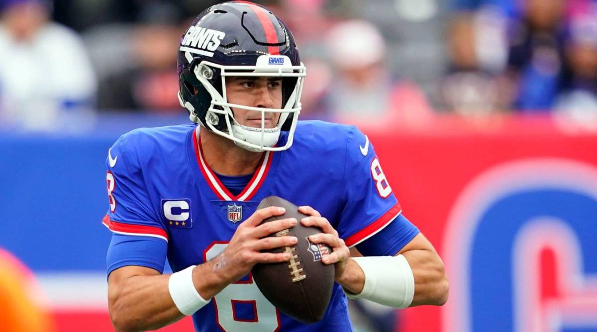 Giants quarterback Daniel Jones rolls out to pass in a game vs. the Chicago Bears.