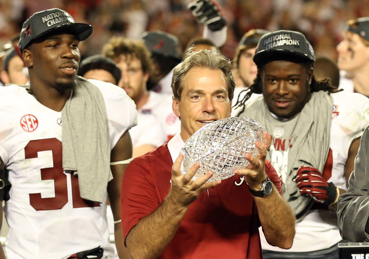 Alabama Crimson Tide head coach Nick Saban holds the Coaches Trophy after the 2013 BCS Championship game against the Notre Dame Fighting Irish at Sun Life Stadium. Alabama won 42-14.