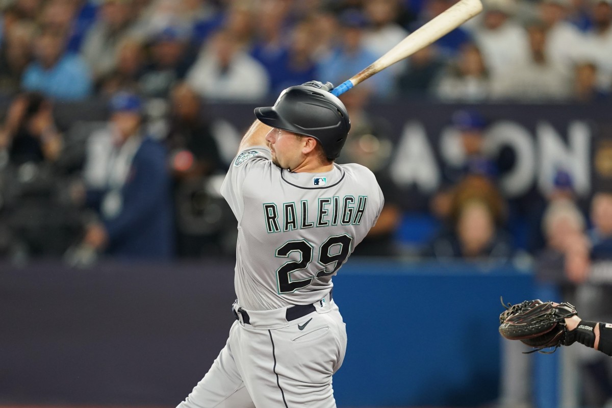 Seattle catcher Cal Raleigh (29) watches his ball on a home run in the first inning against the Toronto Blue Jays on Friday. (Nick Turchiaro-USA TODAY Sports)