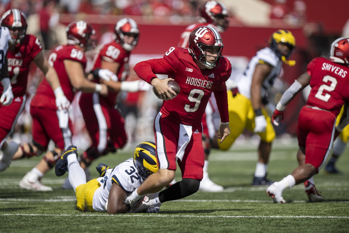 Indiana Hoosiers quarterback Connor Bazelak (9) is sacked by Michigan Wolverines linebacker Jaylen Harrell (32) during the first quarter at Memorial Stadium.