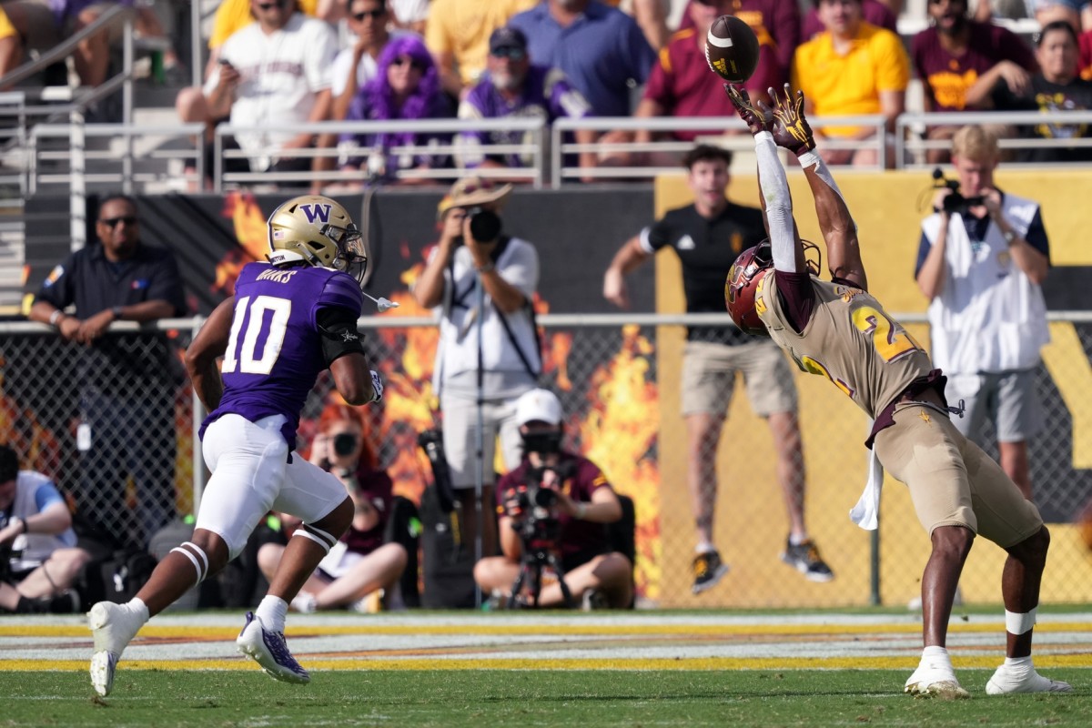 ASU wide receiver Bryan Thompson gets behind the UW's Davon Banks to pull down a pass near the goal line.