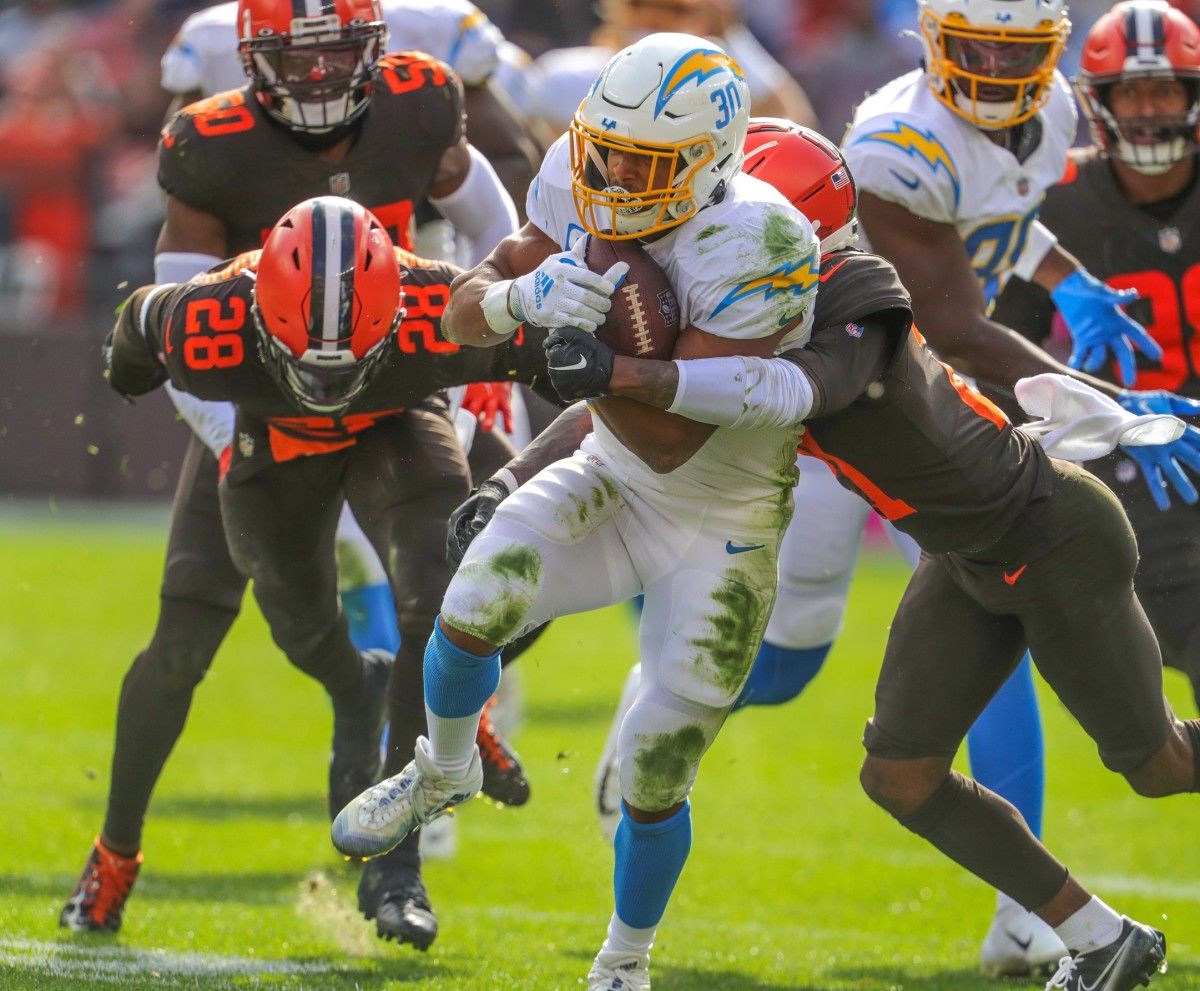 Browns defenders Denzel Ward, right, and Jeremiah Owusu-Koramoah chase down Chargers running back Austin Ekeler on Sunday, Oct. 9, 2022 in Cleveland. Akr 10 9 Browns Chargers 11