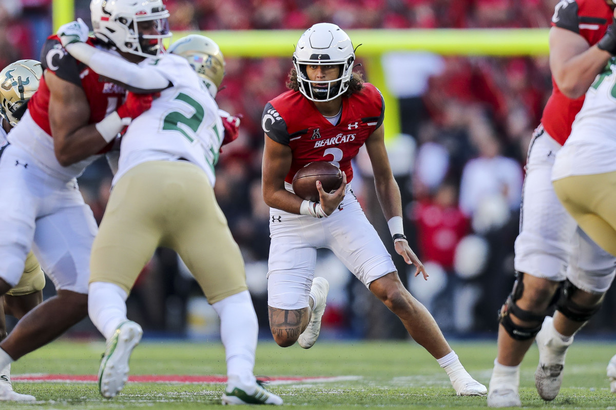 Oct 8, 2022; Cincinnati, Ohio, USA; Cincinnati Bearcats quarterback Evan Prater (3) runs with the ball against the South Florida Bulls in the second half at Nippert Stadium. Mandatory Credit: Katie Stratman-USA TODAY Sports