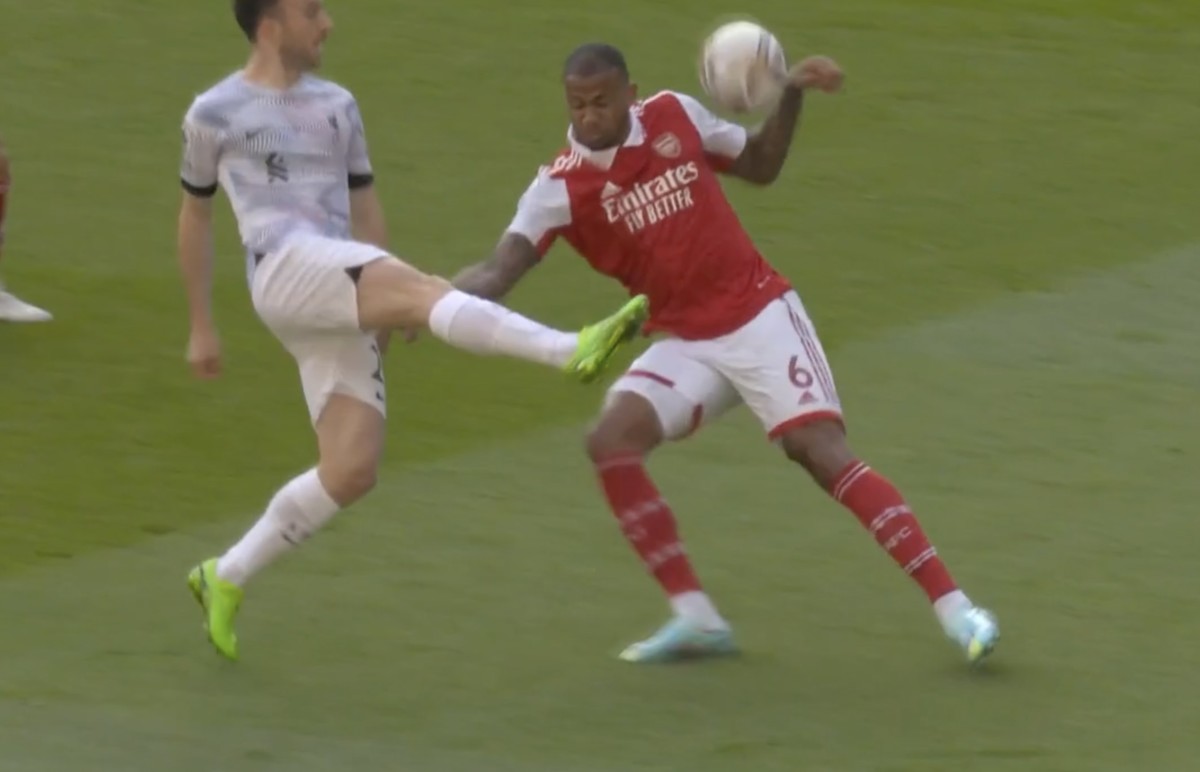 Arsenal defender Gabriel pictured handling a cross from Liverpool forward Diogo Jota (left) during a Premier League game in October 2022