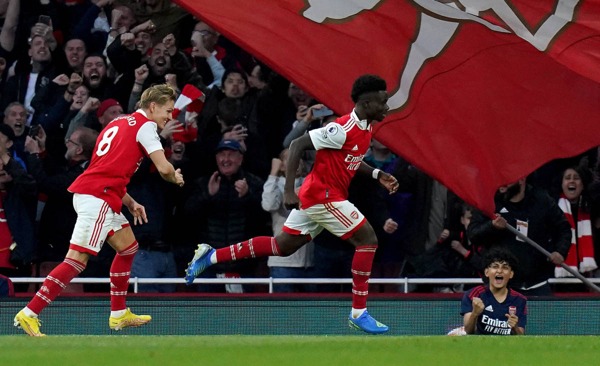 Bukayo Saka pictured (center) after scoring for Arsenal in a 3-2 win over Liverpool in October 2022
