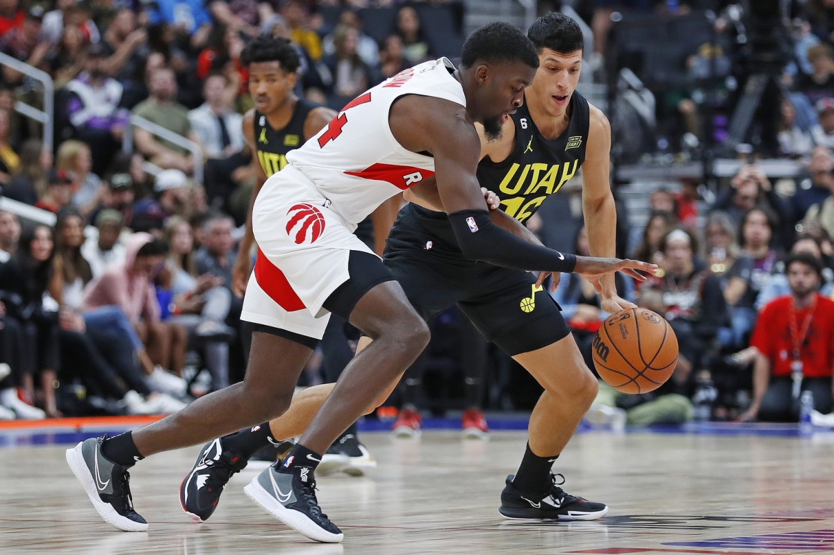 Toronto Raptors center Khem Birch (24) carries the ball around Utah Jazz forward Simone Fontecchio (16) during the fourth quarter at Rogers Place.