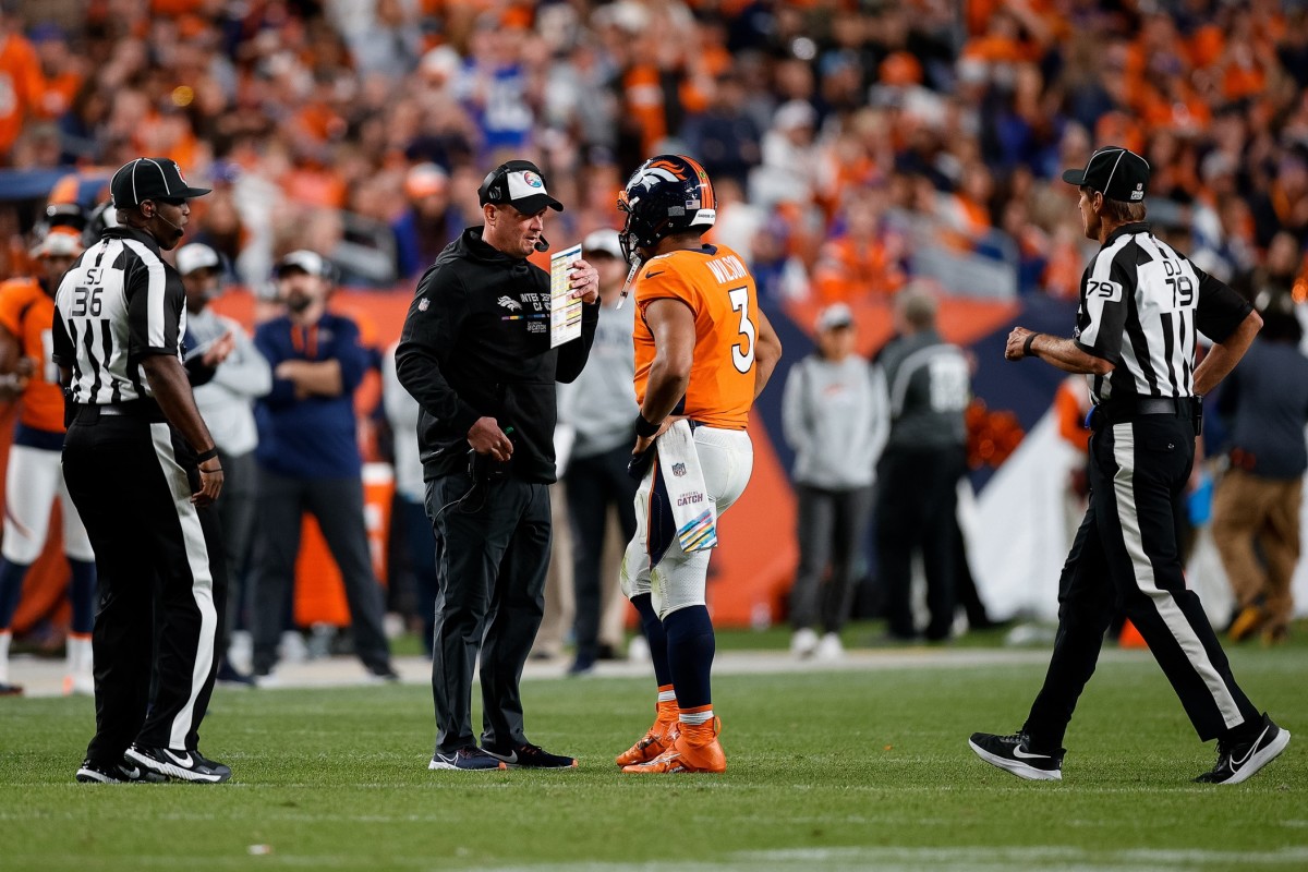 Broncos coach Nathaniel Hackett and quarterback Russell Wilson during Week 5 on Thursday Night Football.