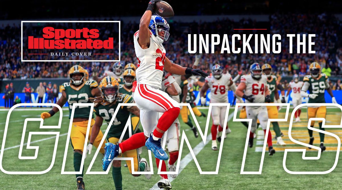 Saquon Barkley leaps into the end zone as Packers defenders look on