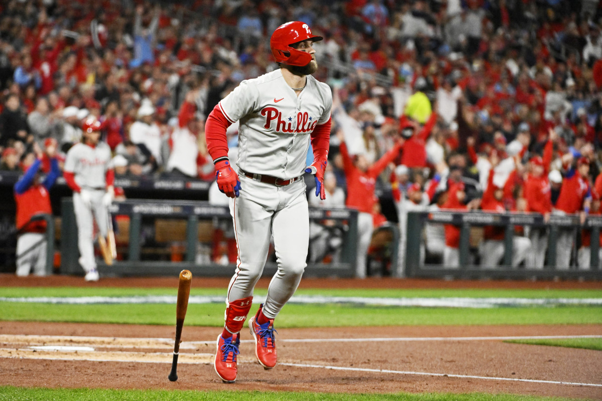 Bryce Harper drops his bat and watches his go-ahead home run against the Cardinals.