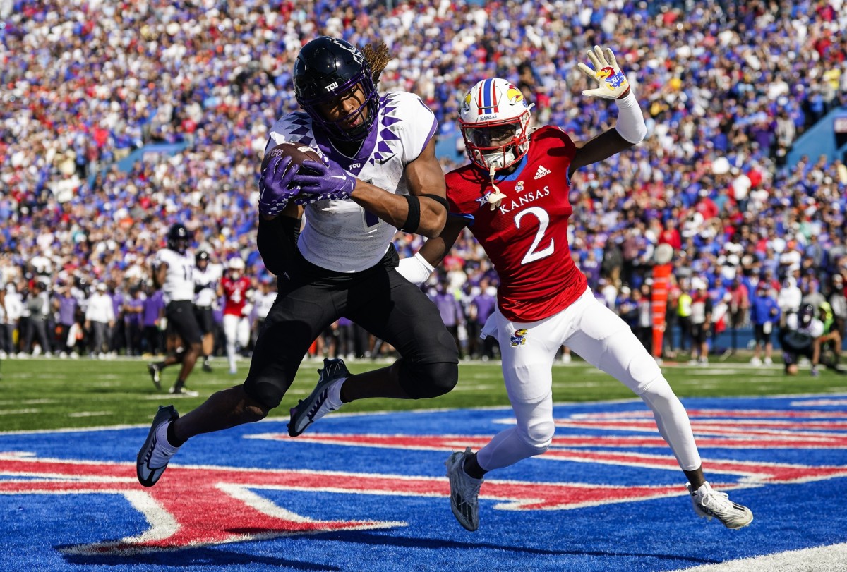 Oct 8, 2022; Lawrence, Kansas, USA; TCU Horned Frogs wide receiver Quentin Johnston (1) catches a touchdown pass against Kansas Jayhawks cornerback Cobee Bryant (2) during the second half at David Booth Kansas Memorial Stadium.