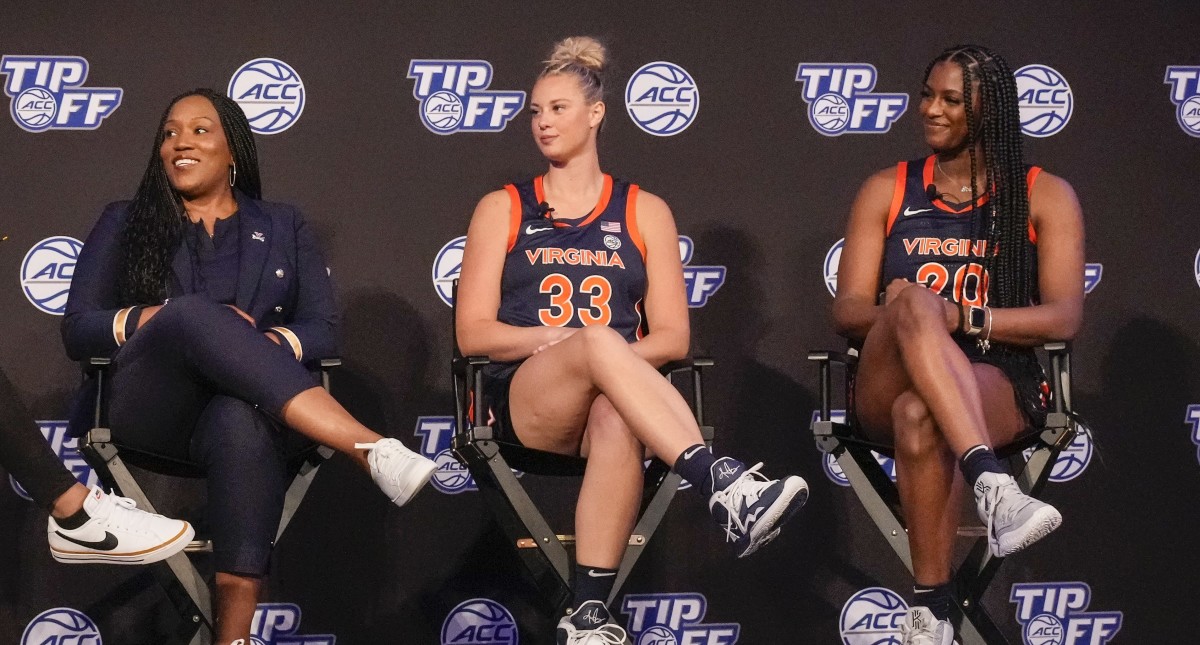 Virginia head coach Amaka Agugua-Hamilton along with Sam Brunelle and Camryn Taylor during the ACC Women s Basketball Tip-Off in Charlotte, NC.