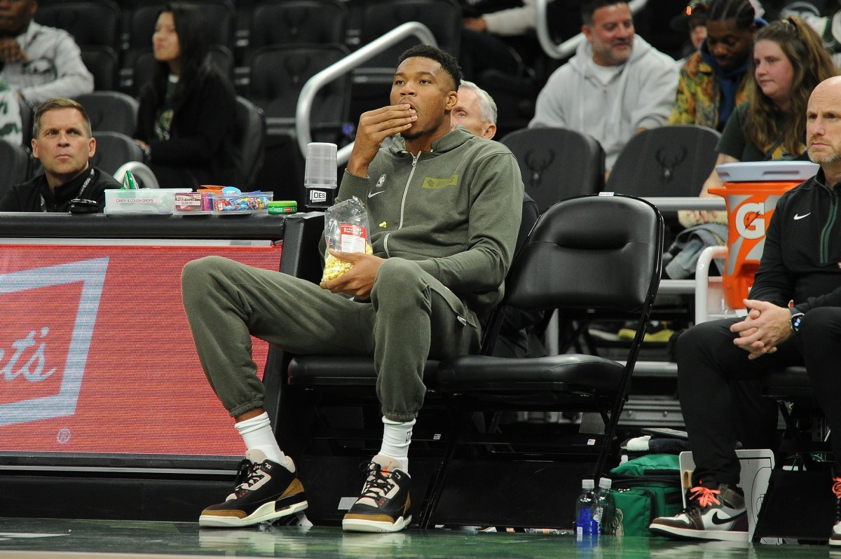 Milwaukee Bucks forward Giannis Antetokounmpo (34) eating popcorn while he watches the Milwaukee Bucks and Memphis Grizzlies game