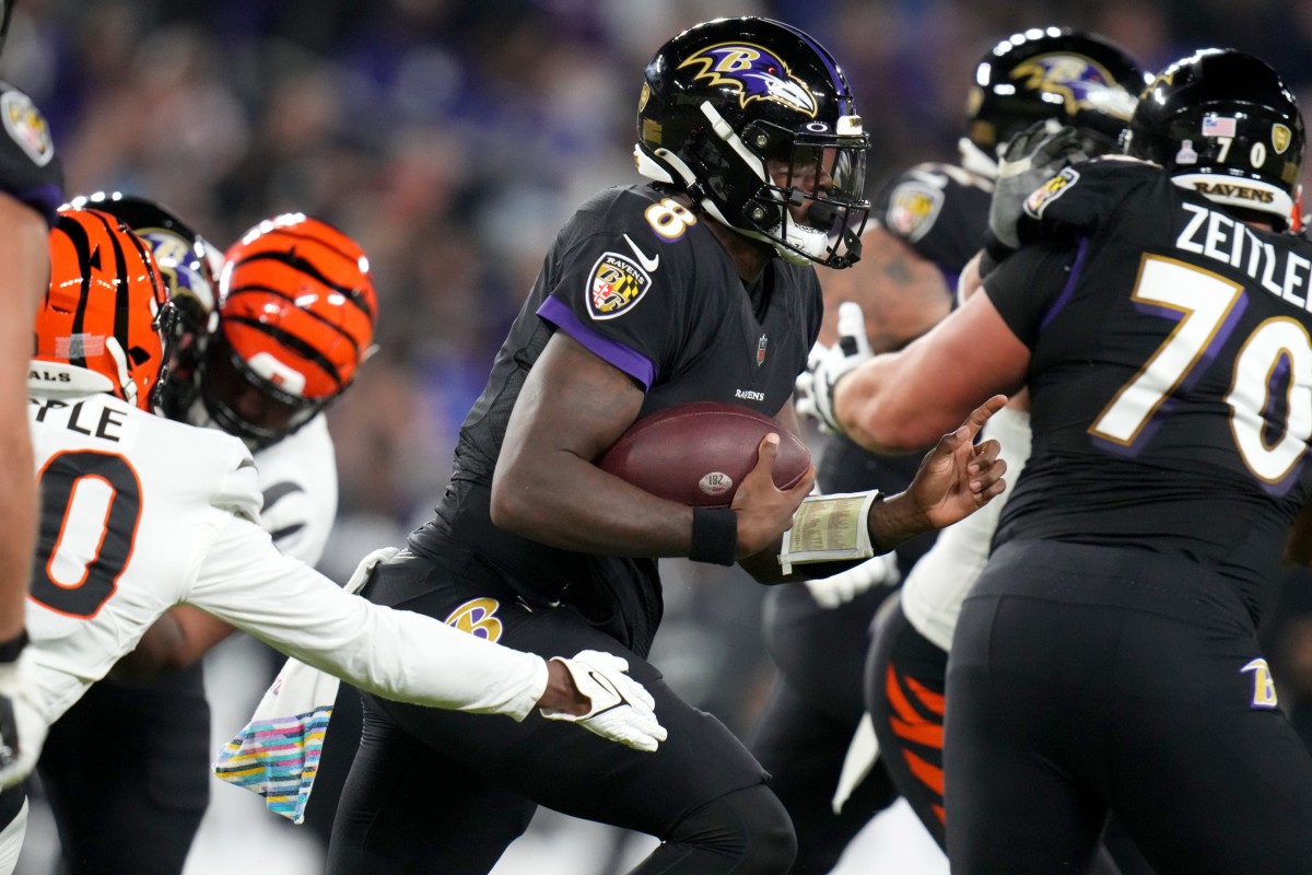 Baltimore Ravens quarterback Lamar Jackson (8) find running room in the second quarter during an NFL Week 5 game against the Cincinnati Bengals, Sunday, Oct. 9, 2022, at M&T Bank Stadium in Baltimore.