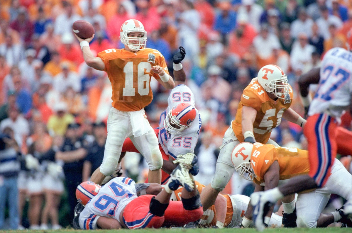 Peyton Manning throws a pass under pressure in a game for the Tennessee Vols.