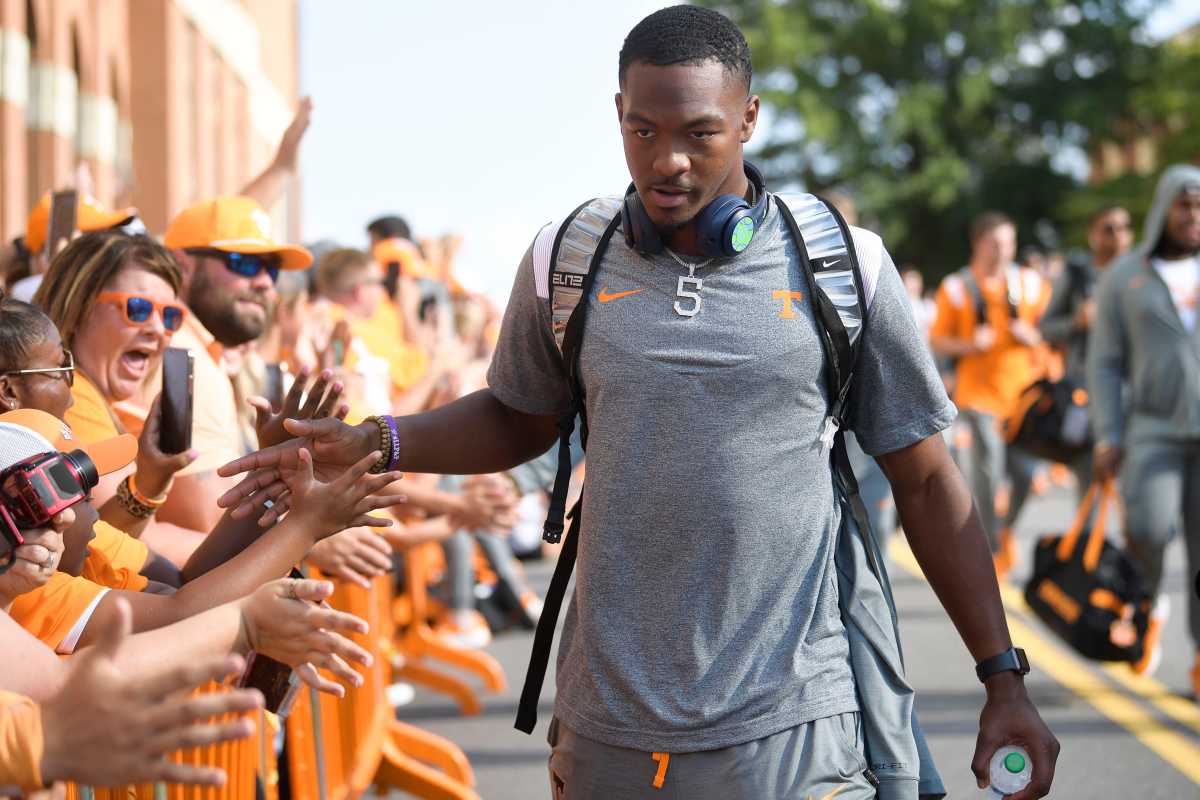 Tennessee QB Hendon Hooker greets fans as he heads to Neyland Stadium.