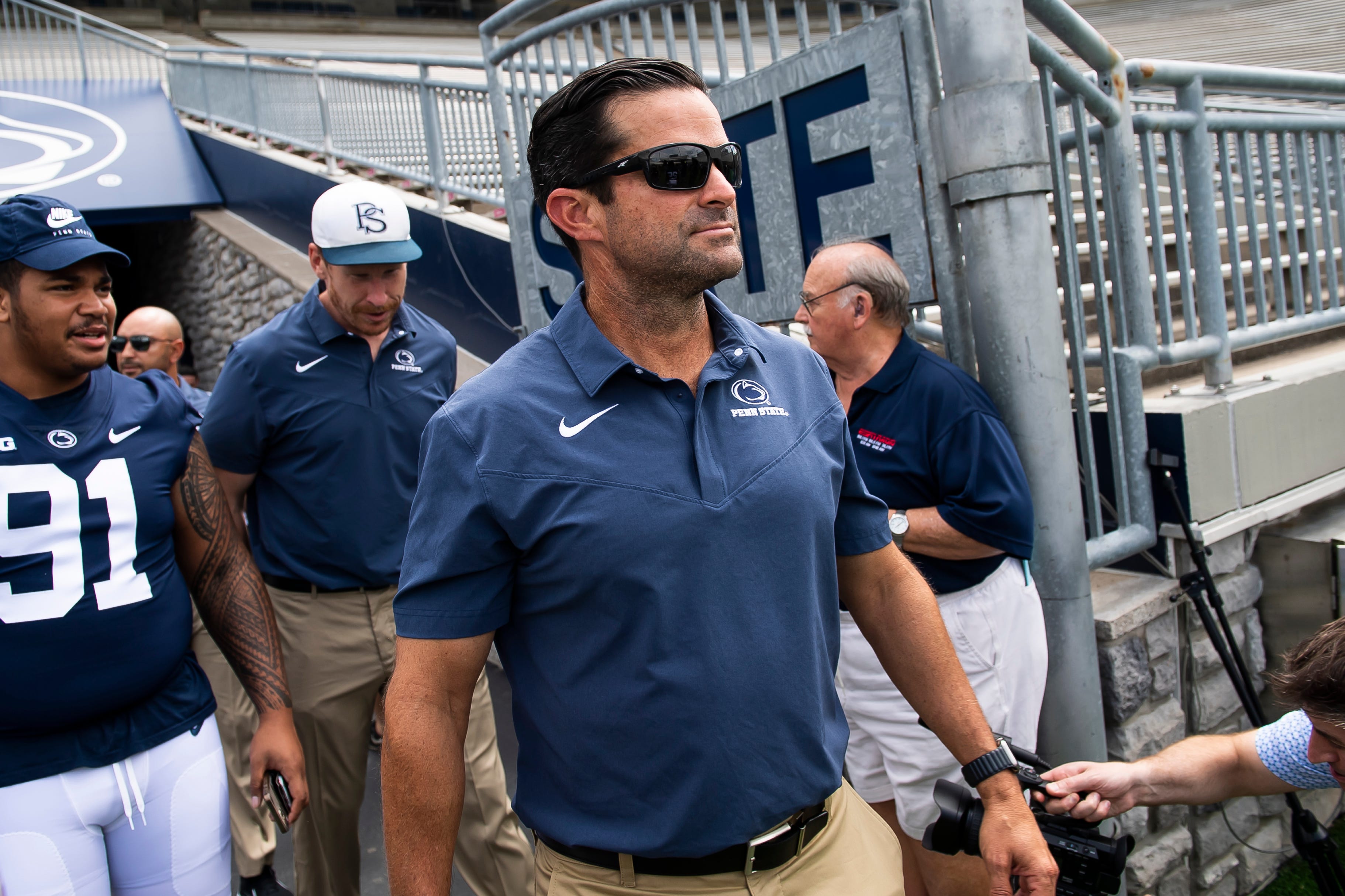 Penn State defensive coordinator Manny Diaz enters Beaver Stadium for the Nittany Lions' 2023 media day.