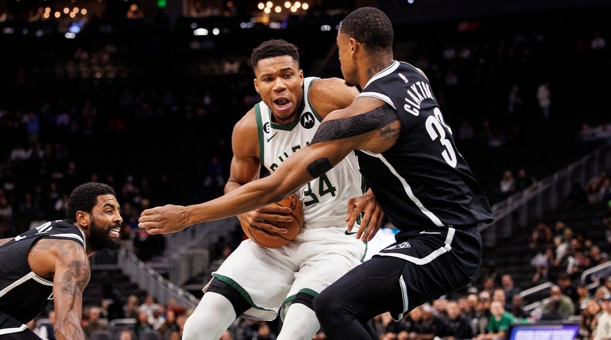 Oct 12, 2022; Milwaukee, Wisconsin, USA; Milwaukee Bucks forward Giannis Antetokounmpo (34) drives for the basket against Brooklyn Nets forward Nic Claxton (33) during the first quarter at Fiserv Forum.