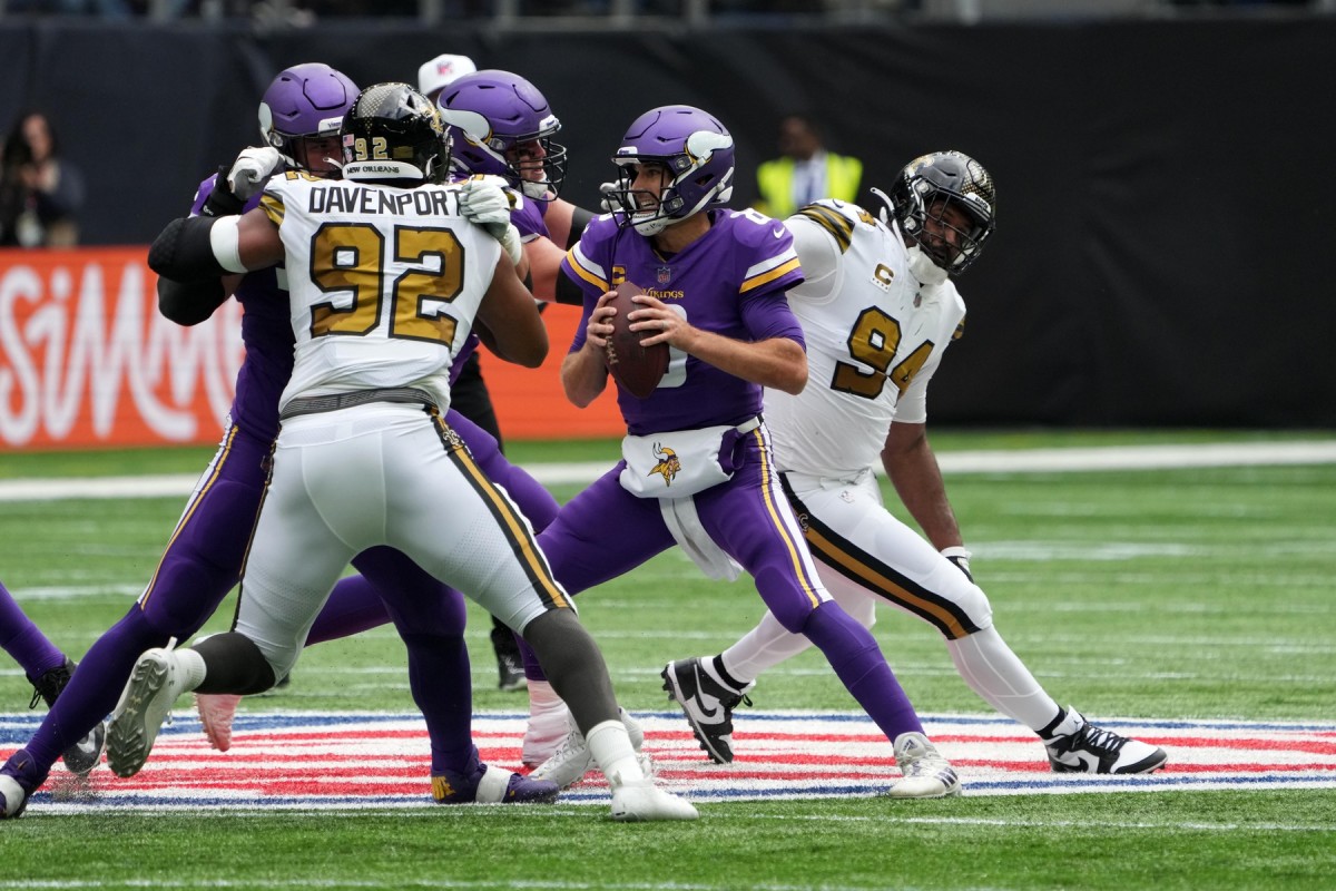 Oct 2, 2022; Minnesota Vikings quarterback Kirk Cousins (8) is pressured by New Orleans Saints defensive end Cameron Jordan (94) and defensive end Marcus Davenport (92). Mandatory Credit: Kirby Lee-USA TODAY Sports
