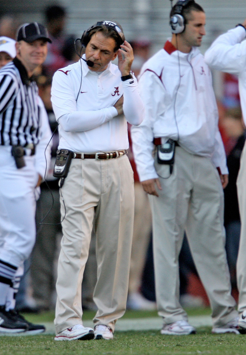 Alabama coach Nick Saban talks to his coaches over a headset during a 2009 game.