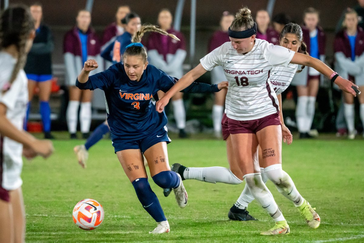 Virginia women's soccer midfielder Alexis Theoret fights for the ball against Virginia Tech.