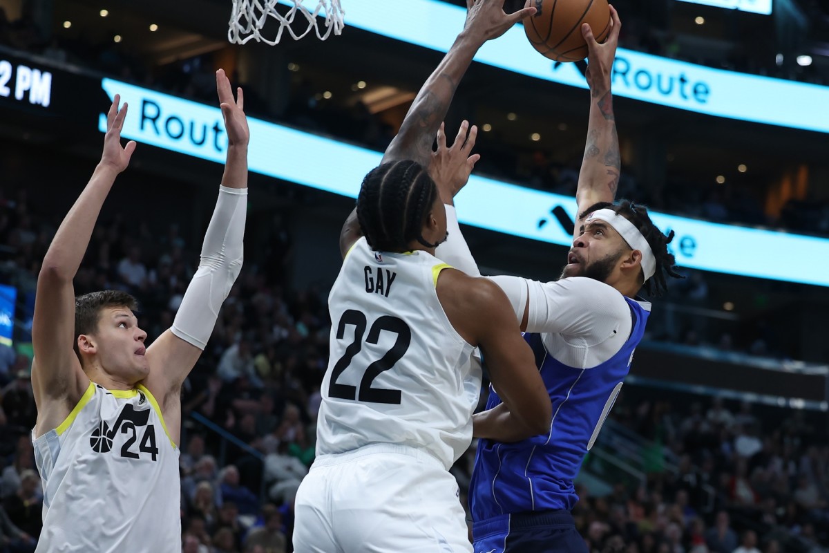 Dallas Mavericks center JaVale McGee (00) shoots the ball against Utah Jazz forward Rudy Gay (22) and center Walker Kessler (24) in the first half at Vivint Arena.