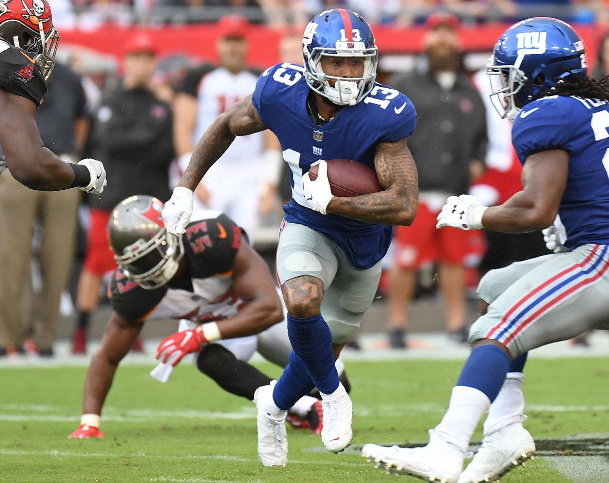 Oct 1, 2017; Tampa, FL, USA; New York Giants wide receiver Odell Beckham Jr. (13) runs with the ball in the first half against the Tampa Bay Buccaneers at Raymond James Stadium.