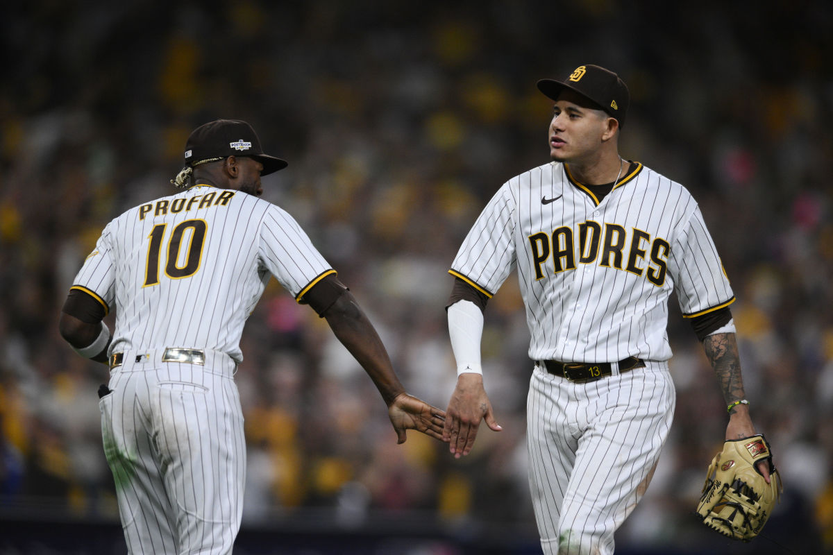 San Diego Padres left fielder Jurickson Profar (10) celebrates with San Diego Padres third baseman Manny Machado (13) after defeating Los Angeles Dodgers during game three of the NLDS for the 2022 MLB...