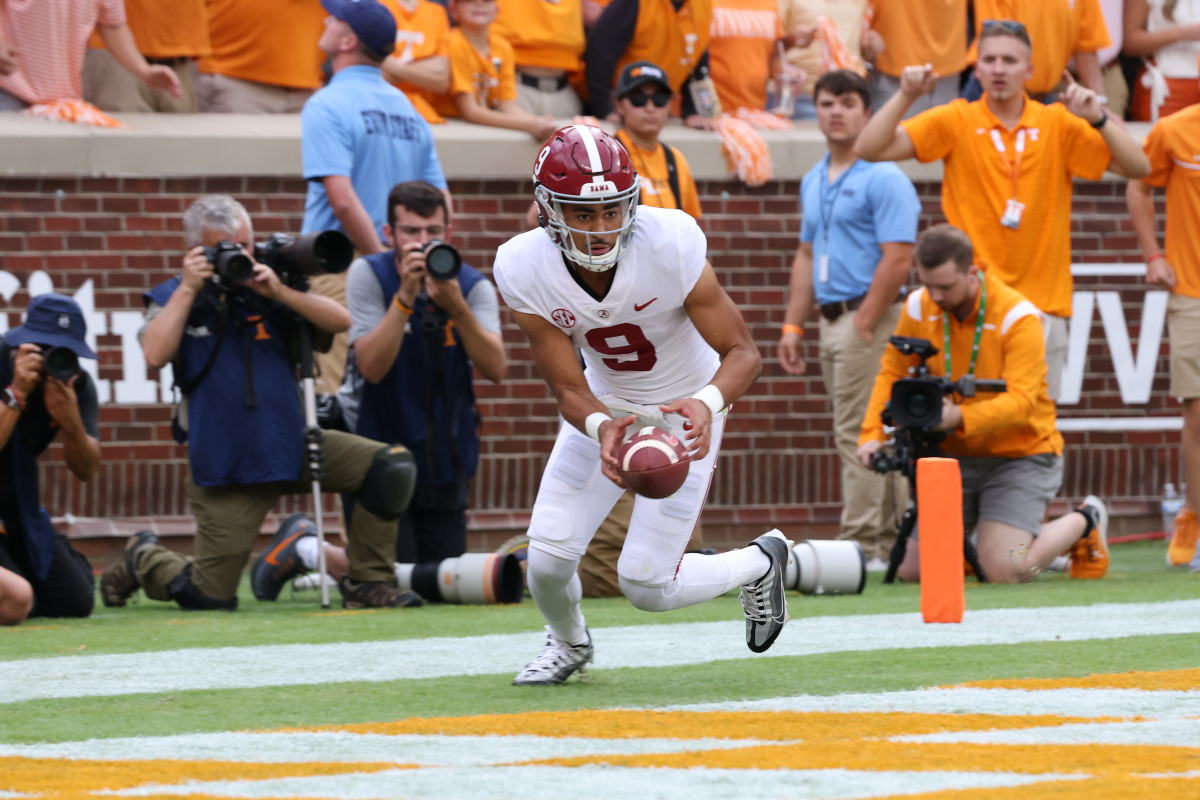 Alabama Crimson Tide quarterback Bryce Young (9) has trouble with the snap during the first quarter against the Tennessee Volunteers at Neyland Stadium.