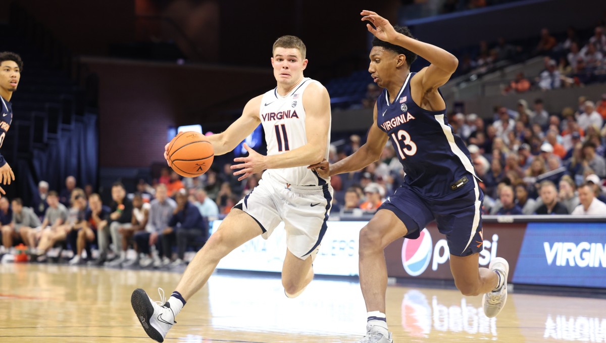 Isaac McKneely drives against Ryan Dunn during the Virginia men's basketball Blue-White Scrimmage at John Paul Jones Arena.