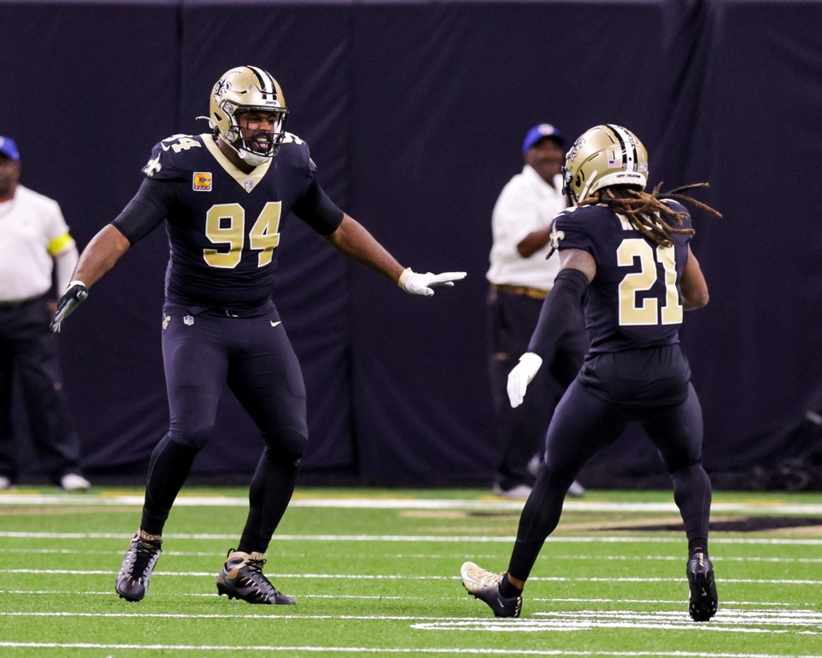 Oct 9, 2022; New Orleans Saints defensive end Cameron Jordan (94) celebrates with cornerback Bradley Roby (21) after sacking Seattle Seahawks quarterback Geno Smith (7). Mandatory Credit: Stephen Lew-USA TODAY Sports
