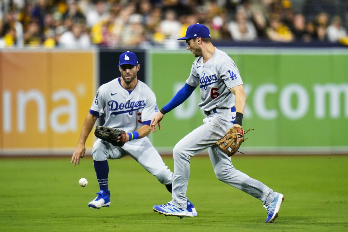 Dodgers shortstop Trea Turner goes for the baseball after dropping a popup against the Padres.