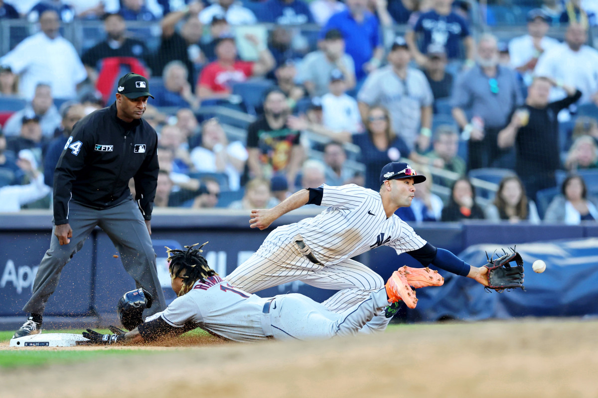 Guardians third baseman José Ramírez slides safely into third base to lead off the 10th inning of their ALDS Game 2 win over the Yankees.