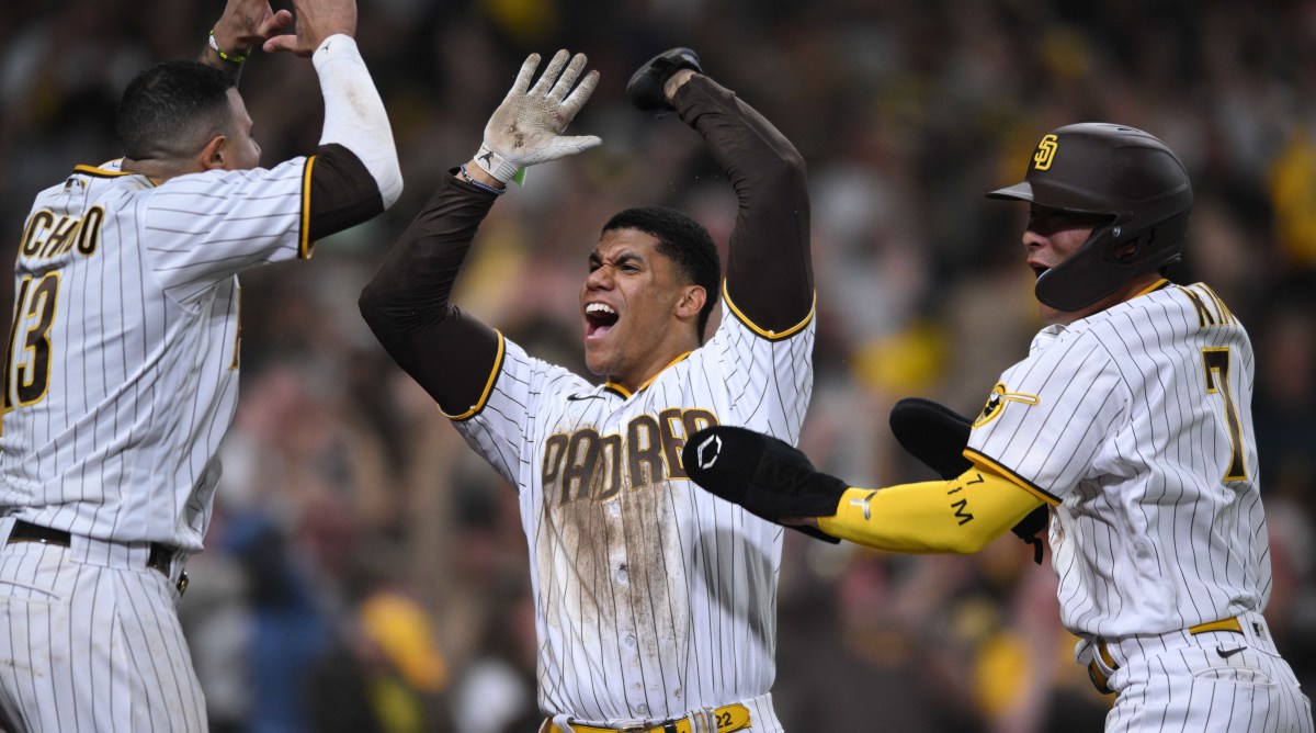 Juan Soto celebrates with his Padres teammates