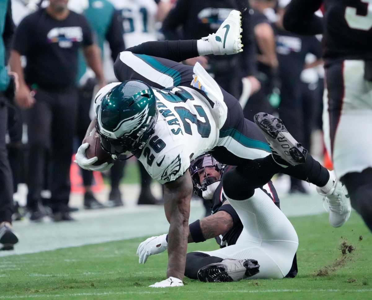  Oct 9, 2022; Glendale, Arizona, U.S.; Philadelphia Eagles running back Miles Sanders (26) is tackled by Arizona Cardinals cornerback Byron Murphy Jr. (7) after a catch during the third quarter at State Farm Stadium. Nfl Eagles 