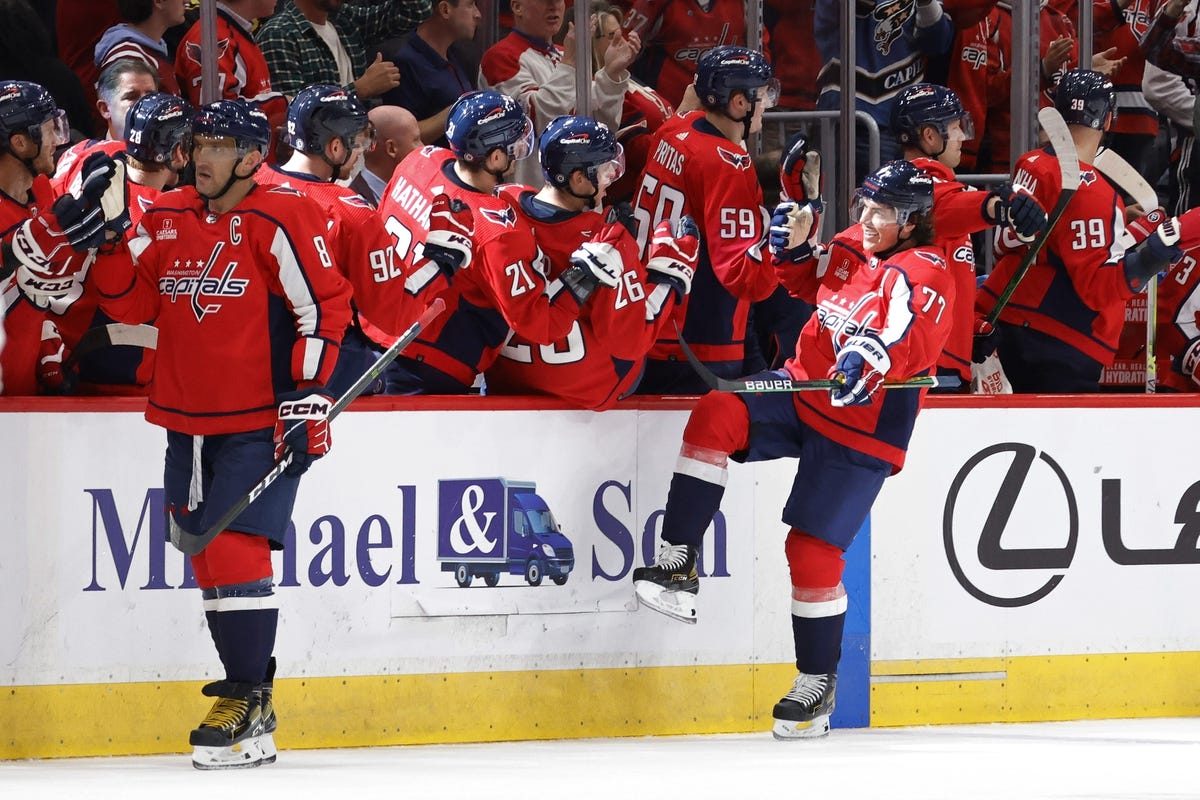 Oct 15, 2022; Washington, District of Columbia, USA; Washington Capitals right wing T.J. Oshie (77) celebrates with teammates after scoring a goal against the Montreal Canadiens in the second period at Capital One Arena. Mandatory Credit: Geoff Burke-USA TODAY Sports