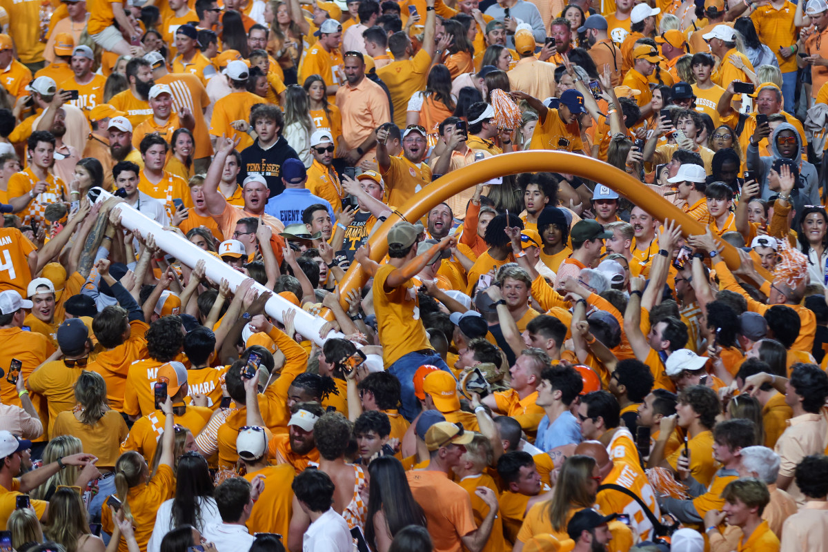 Fans tear down a goal post after UT’s win over Bama.