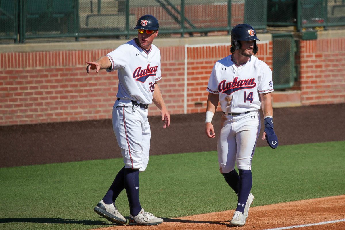 Justin Kirby ignores baserunning direction from Auburn assistant coach Gabe Gross during fall exhibition action