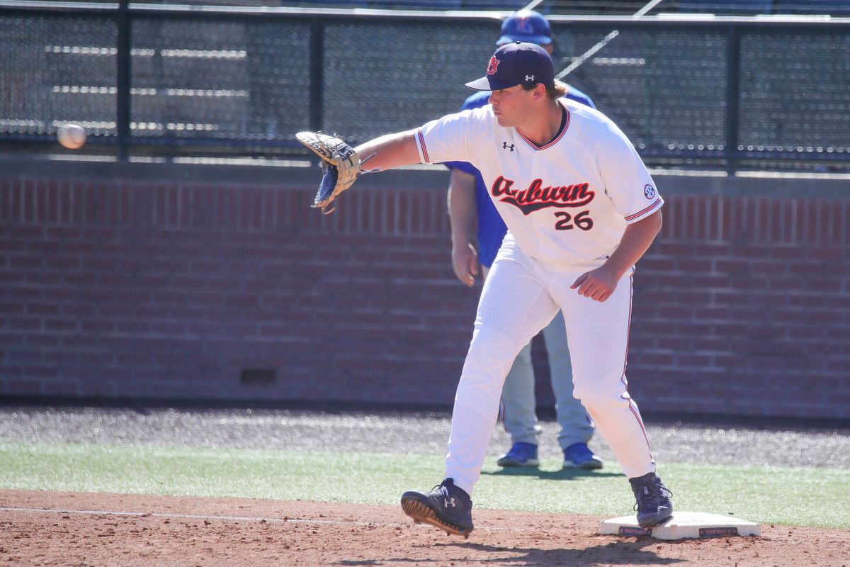 Cooper McMurray fields a throw at first against Louisiana Tech in fall exhibition action
