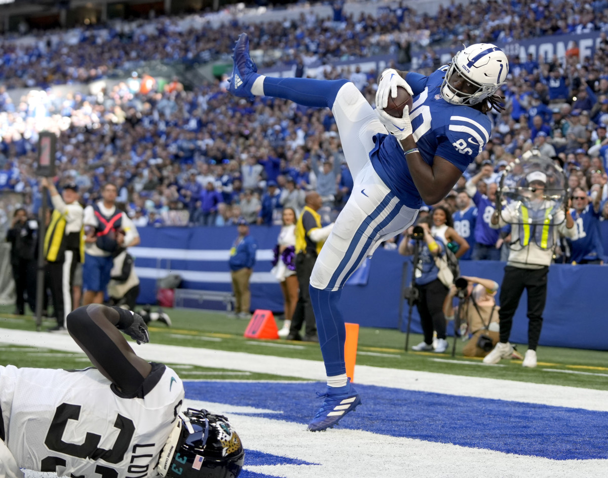 Oct 16, 2022; Indianapolis, Indiana, USA; Indianapolis Colts tight end Jelani Woods (80) comes down in the end zone with the ball for a touchdown against the Jacksonville Jaguars during the second half at Lucas Oil Stadium. Mandatory Credit: Robert Scheer-USA TODAY Sports