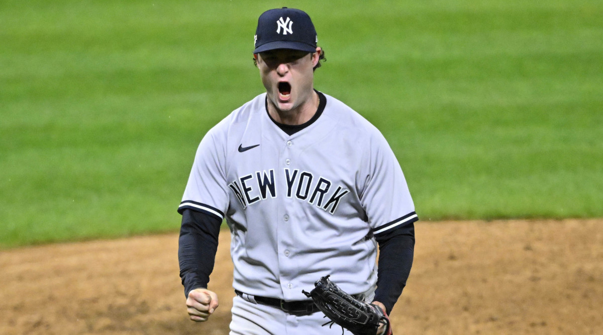 Yankees pitcher Gerrit Cole yells in celebration after finishing the seventh inning of Game 4 of the 2022 ALDS.
