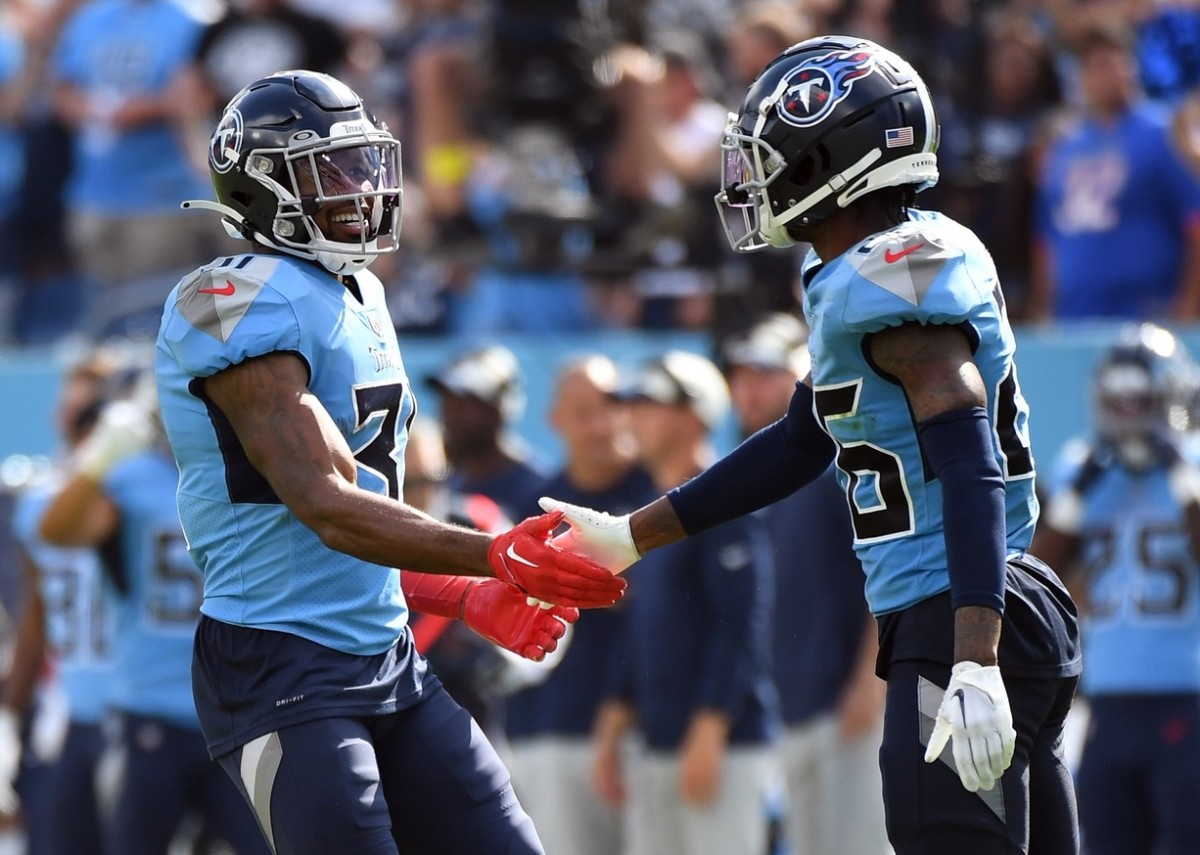 Tennessee Titans safety Kevin Byard (31) and cornerback Kristian Fulton (26) celebrate after a defensive stop during the second half against the Las Vegas Raiders at Nissan Stadium.