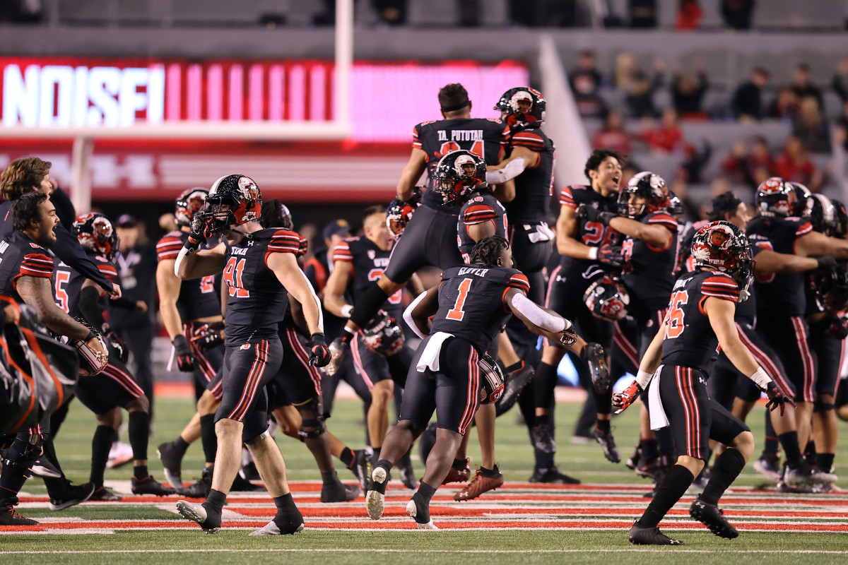 Utah Utes players celebrate their last minute win over the USC Trojans at Rice-Eccles Stadium.