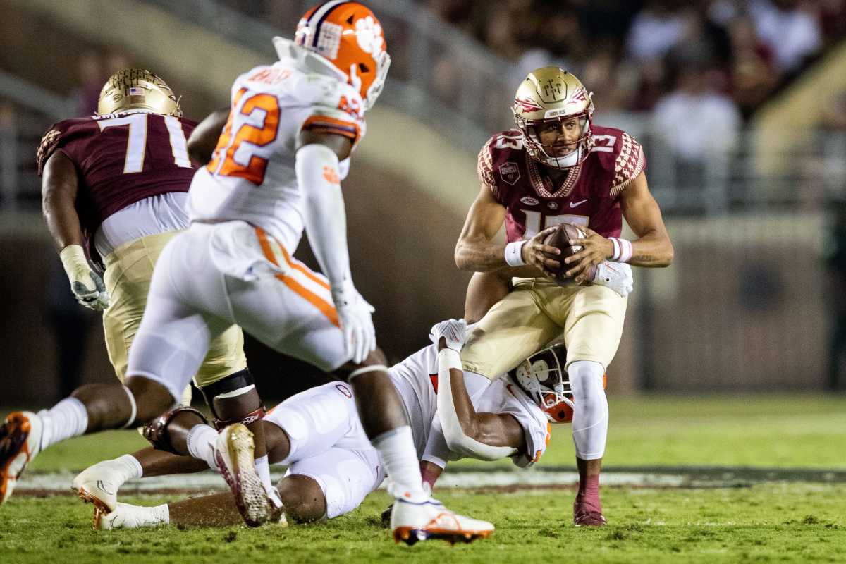 Florida State QB #13 Jordan Travis faced pressure all game from the Clemson pass rush