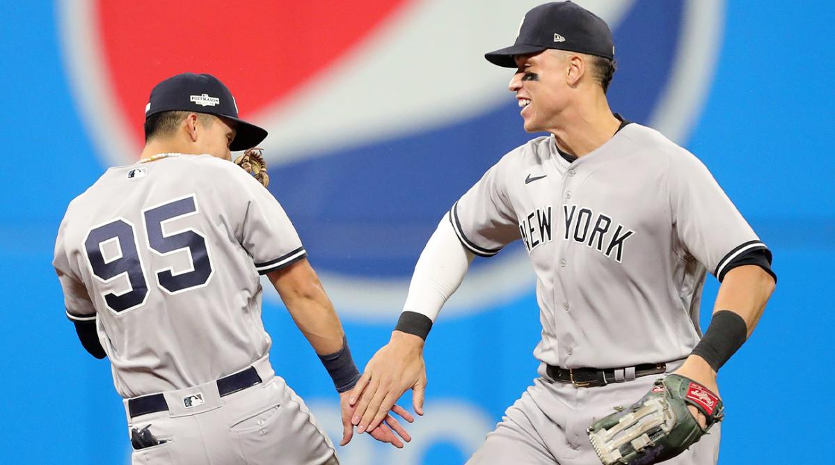 New York Yankees center fielder Aaron Judge (99) celebrates with New York Yankees first baseman Oswaldo Cabrera (95) after winning Game 4 of an American League Division baseball series at Progressive Field, Sunday, Oct. 16, 2022, in Cleveland, Ohio. Alds Game 4 26